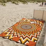 Helios Oversized Blanket set up on the beach
