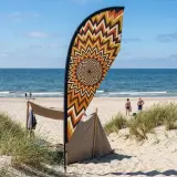 Helios Teardrop Flag set up on the beach