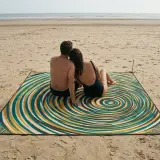 Ripple Beach Blanket next to an adult for size