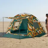Swell Family Beach Tent next to an adult for size