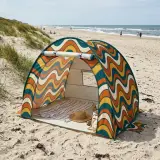 Swell Pop-Up Tent set up on the beach