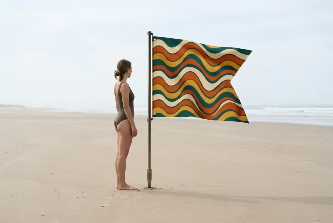 Swell Swallowtail Flag next to an adult for size